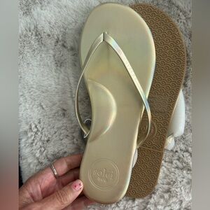 Gold Flip Flops sold on Revolve